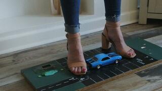 Priscilla toy car crush she crushes a 1969 Chevrolet Camaro in big heels close left upper view