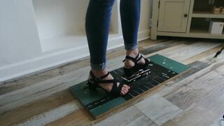 Priscilla toy car crush she crushes a 1957 Chevy in black heels close left upper view