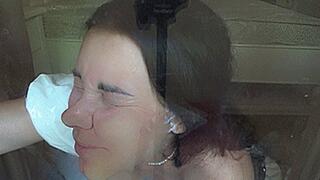 the maid presses herself against the glass