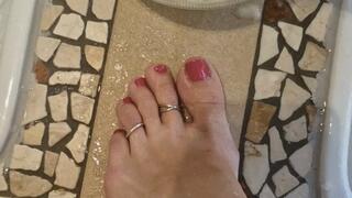 Carina is taking care of her feet with a scrub in the private spa