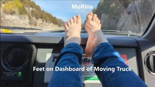 Feet on Dashboard of Moving Truck