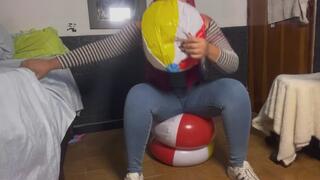 Join me as I blow beach balls while I bounce on two beach balls