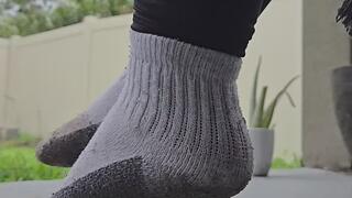 Swinging with dirty feet in dirty socks!