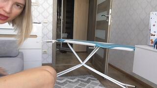 ON A BROKEN IRONING BOARD IN A LEOPARD BATHSUIT