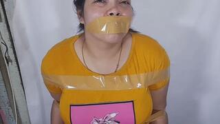 Fat girl is tied with tape, tries to escape but can't