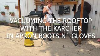 VACUUMING THE ROOFTOP WITH THE KARCHER IN APRON AND BOOTS