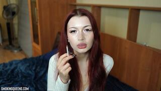 Adelina is smoking All White Super Slim Vogue cigarette in the bedroom Close-up | 4k video resolution
