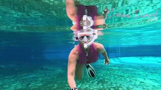 Carissa in the pink suit snorkeling in the springs and topless
