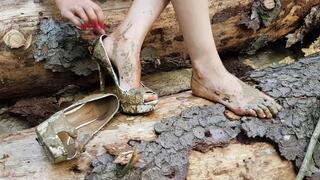 Expensive high heels in the forest, wet and muddy high heels, high heels wrecked in mud, high heels ruined, high heels stuck, high heels messy, high heels in forest, high heels in swamp