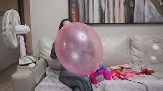 Owllete blows up balloons in venom suit