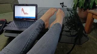 Woman with cute feet and pronounced arches making changes of stiletto heels on her feet (2)