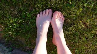 Walking with my feet on the grass and showing them to you up