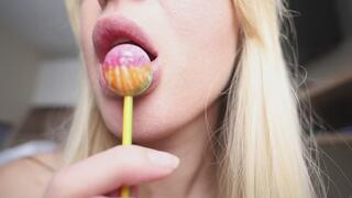Lips licking and lolipop