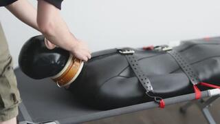 Twink strapped into the neoprene sack and edged relentlessly