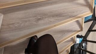 Playing in nylons catsuit, feet in sandals