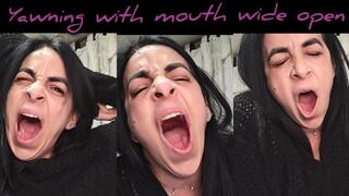 Yawning with mouth wide open