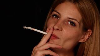 Eve always lets a long ash build up on her cigarette when she smokes 120's