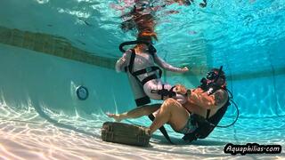 Aquaphilias- Misty Rein- she tries to open the UW safe and gets caught