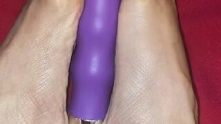 Melove finding a new way to play with her toy with her sexy feet with no nail polish