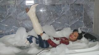 Underwater and Welook in jeans and boots in the bathtub