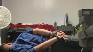 Guy in dress clothes in a hog tie