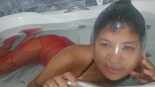 XXL condom and black swimcap breath play