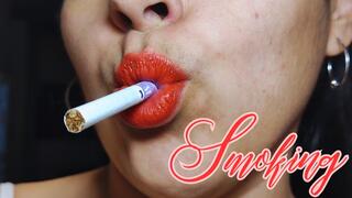Smoking red lips close up