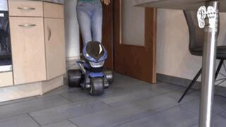 Electrical Motobike under two booted Girls