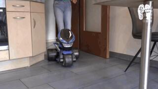 Electrical Motobike under two booted Girls and shredder