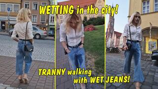 Public wetting in the middle of the city!! Tranny walking with wet jeans!