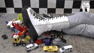 Toy cars and toy stuff under heavy Boots