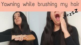 Yawning while brushing my long hair