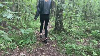 The girl was walking in the park in high-heeled shoes and wanted to go to the toilet, but on the way she fell and twisted her leg, which now hurts terribly