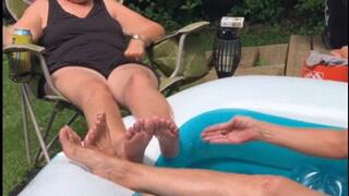 SISTERS PLAYING FOOTSIES