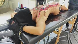 BDSM slave punished with spanking and wax play