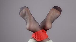 Tied Feet In Black Stockings