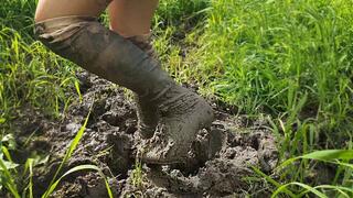High heels boots in deep mud, high heels boots stuck in mud, wrecked high heels boots, knee high boots in mud