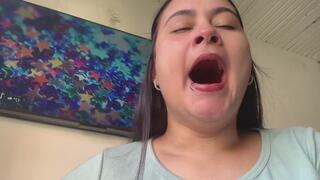 Yawns of a cute girl