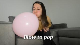 Blow to pop pink balloon