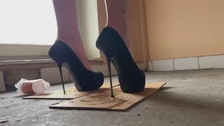 The girl was walking home up the stairs in high-heeled shoes when she suddenly realized that she had stumbled into something very sticky and could not take her shoes off it