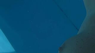 Carissa swimming nude in the pool set to music