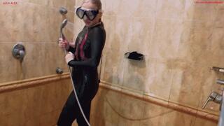 Alla shows off her wetsuit with a diving mask and takes it off in the shower