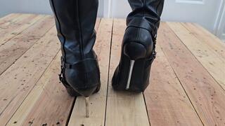Sexy Metal Heel Stiletto Boots Sinking Into Soft Wood