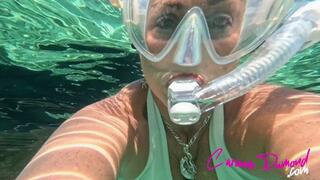 Carissa in the white bikini underwater with the scooter