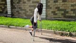 Lia walking on crutches, metal crutches walking, leg cast, twisted ankle, one shoe walk