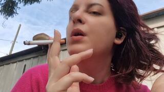 Beautiful italian milf smoking a cigarette in the garden in a sensual way 4K