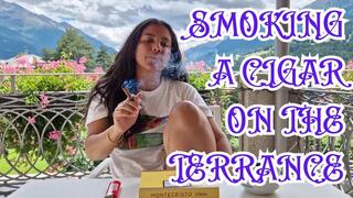 Smoking a cigar on the terrace