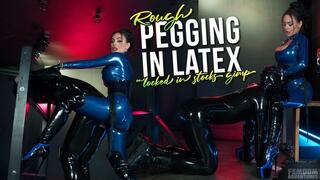 Rough pegging in latex with rubber gimp locked in stocks | Evilwoman