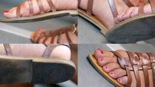 Dirty sandal feet. Foot toenails, soles and heels close-up details.
