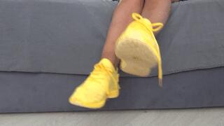 Wiggling my toes inside my soft yellow sneakers a